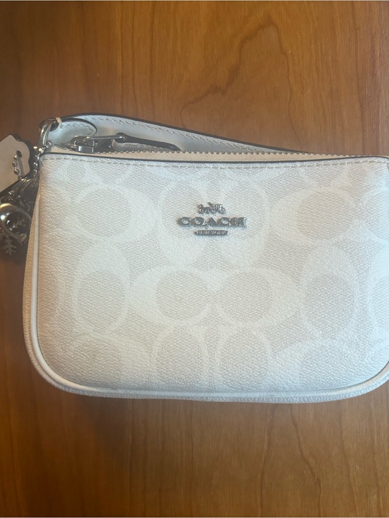 Coach Handbags - Coach White Signature Wristlet with Silver Hardware.